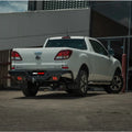 White Mazda BT-50 pickup truck showing the back side with rockamor elite steel rear step and towbar installation