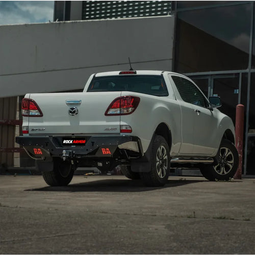 White Mazda BT-50 pickup truck showing the back side with rockamor elite steel rear step and towbar installation