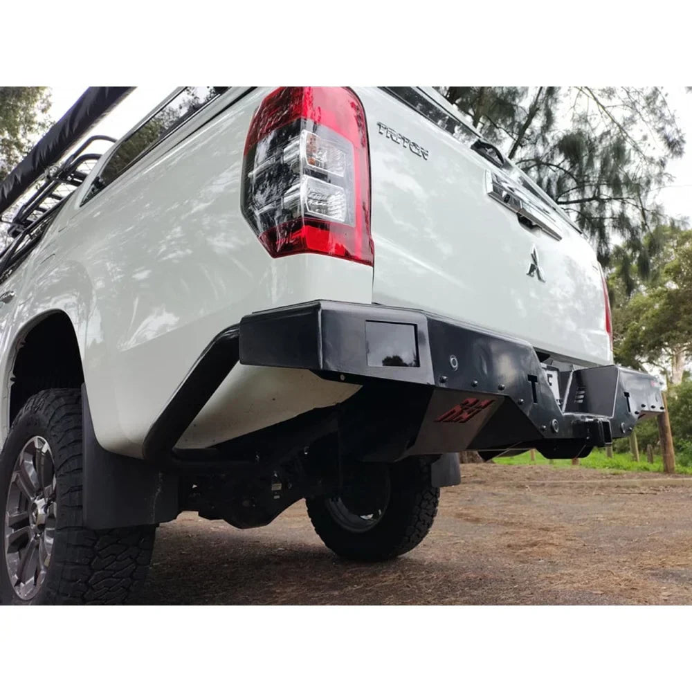 White pickup truck rear with rockarmor elite steel rear step towbar featuring black aftermarket bumper and checker plate step