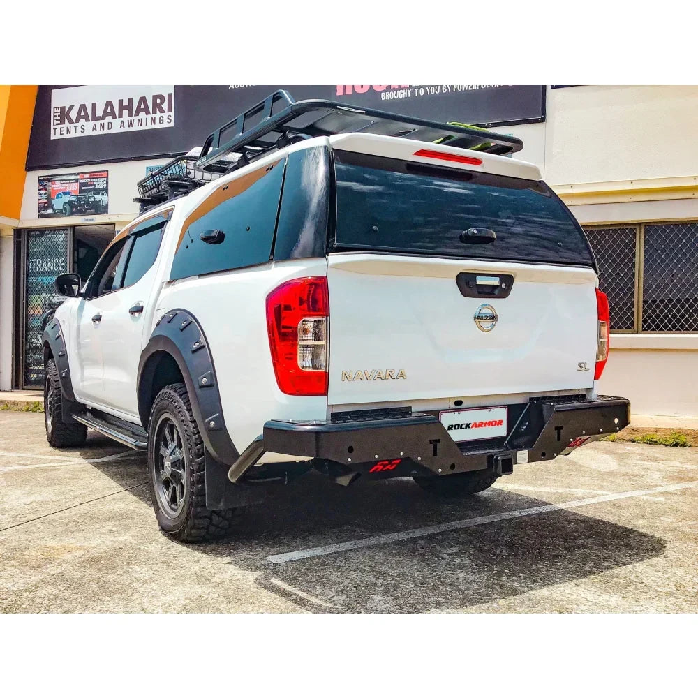 White nissan navara np300 rear view fitted with rockamor elite steel rear step and towbar for np300 d23 2015 to current