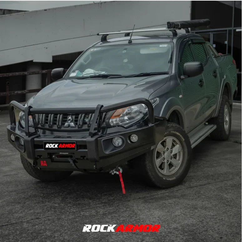 Gray mitsubishi triton with black rockarmor elite bullbar featuring synthetic winch rope for off-road protection