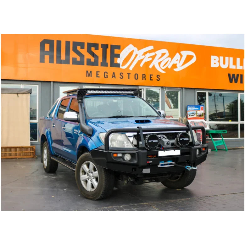Blue off-road Toyota Hilux N70 with rockarmor premium steel bull bar featuring bumper cut design 2005 to 2011 model