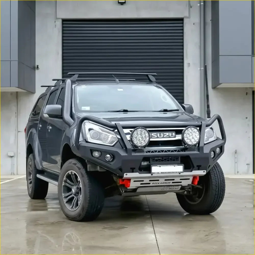 Black isuzu d-max 2017-2020 with rockarmor rock pack featuring gt hoop bullbar roof rack and rock sliders for off-road use