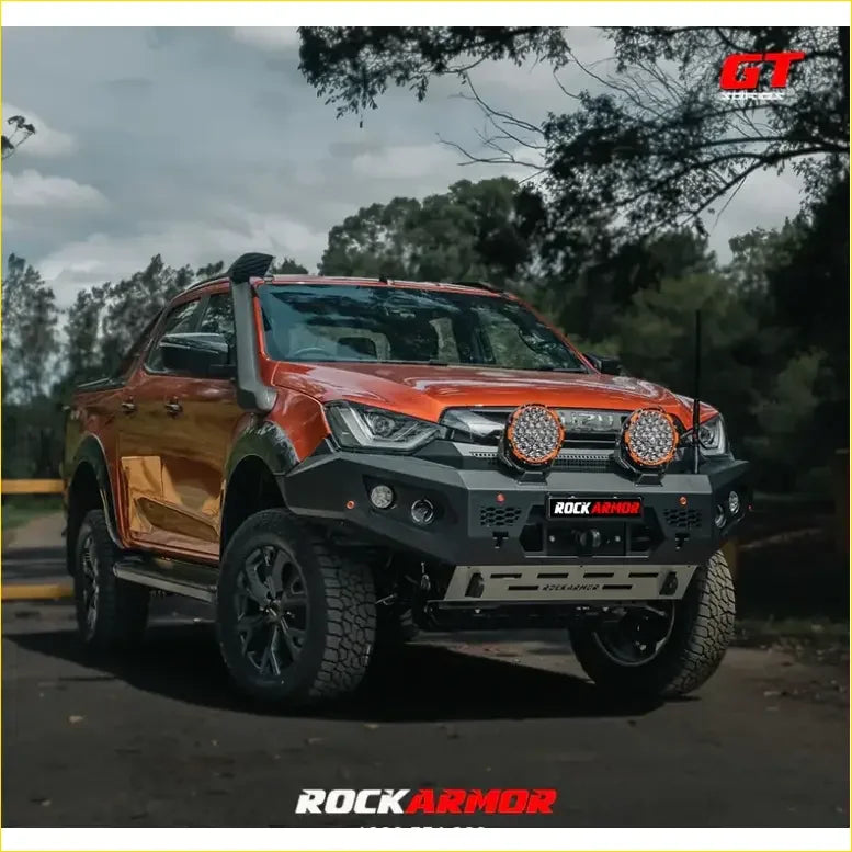 Orange isuzu dmax pickup with black rockarmor gt hoopless bullbar front bumper and round led lights