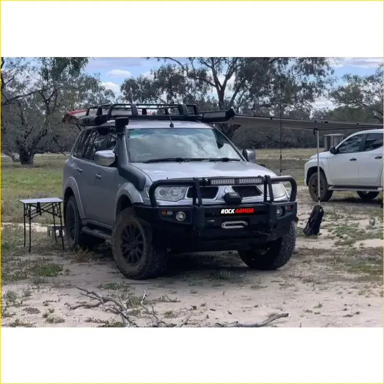Silver mitsubishi triton challenger suv with black rockarmor bullbar and roof rack 2009-2015 model