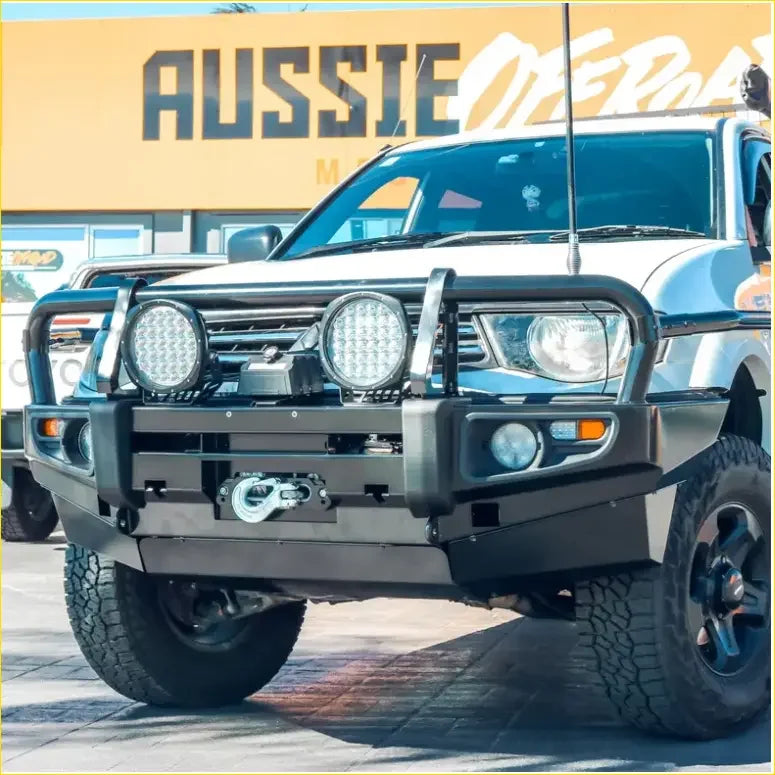 Black metal front bumper with two led lights and winch mount on white mitsubishi triton mn ml 2006-2015 pickup