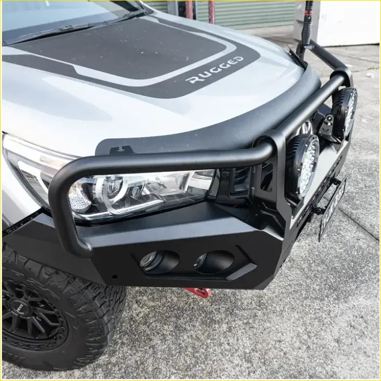 Black metal rockarmor rock pack bullbar with integrated circular lights and angular design for toyota hilux n80 2015-2020