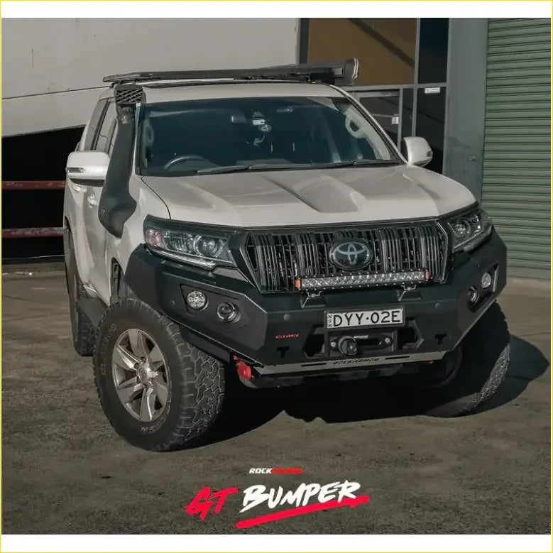 White toyota land cruiser prado with black gt hoopless bullbar and roof rack from rockarmor rock pack
