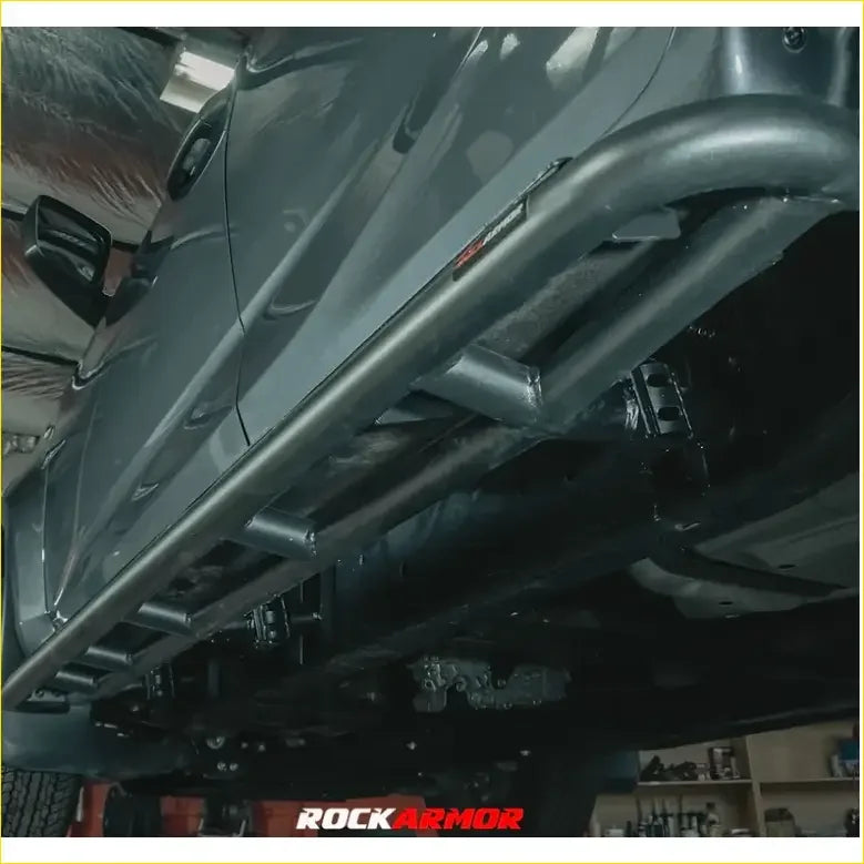 Black metal gt hoop bullbar with rugged tubular design and visible welds for toyota prado 150 series back side view