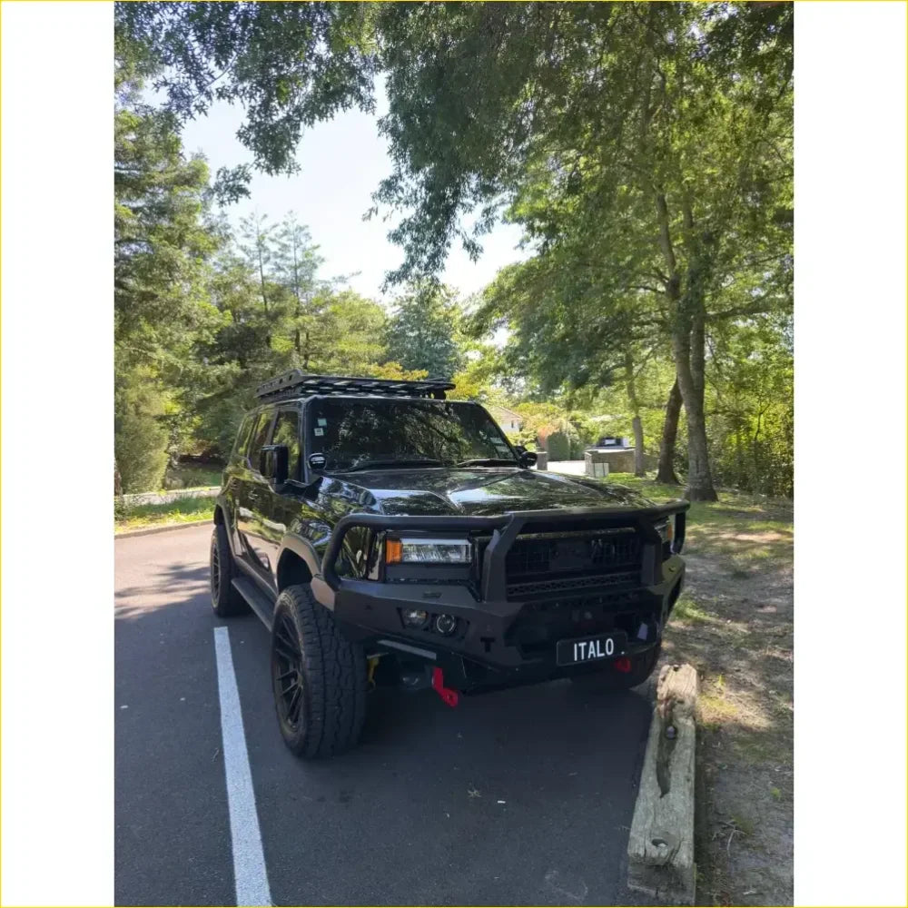 Black rugged toyota prado 250 suv with gt hoop bullbar roof rack and rock sliders from rockarmor rock pack