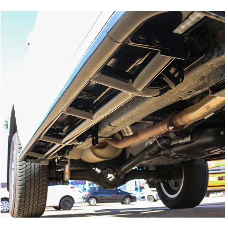Truck undercarriage showing rockarmor steel rockslider side steps in checker plate compatible with brush bar for toyota hilux n90 2026+