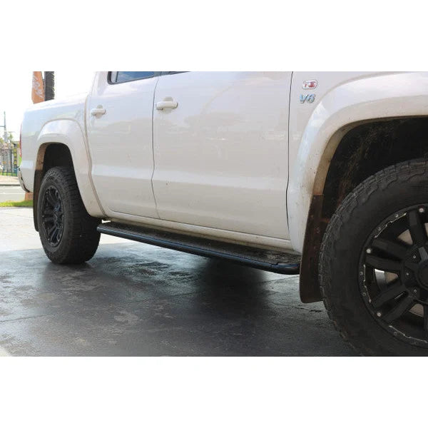 White pickup truck with rockarmor steel rockslider side steps in black suit vw amorok and brush bar compatible
